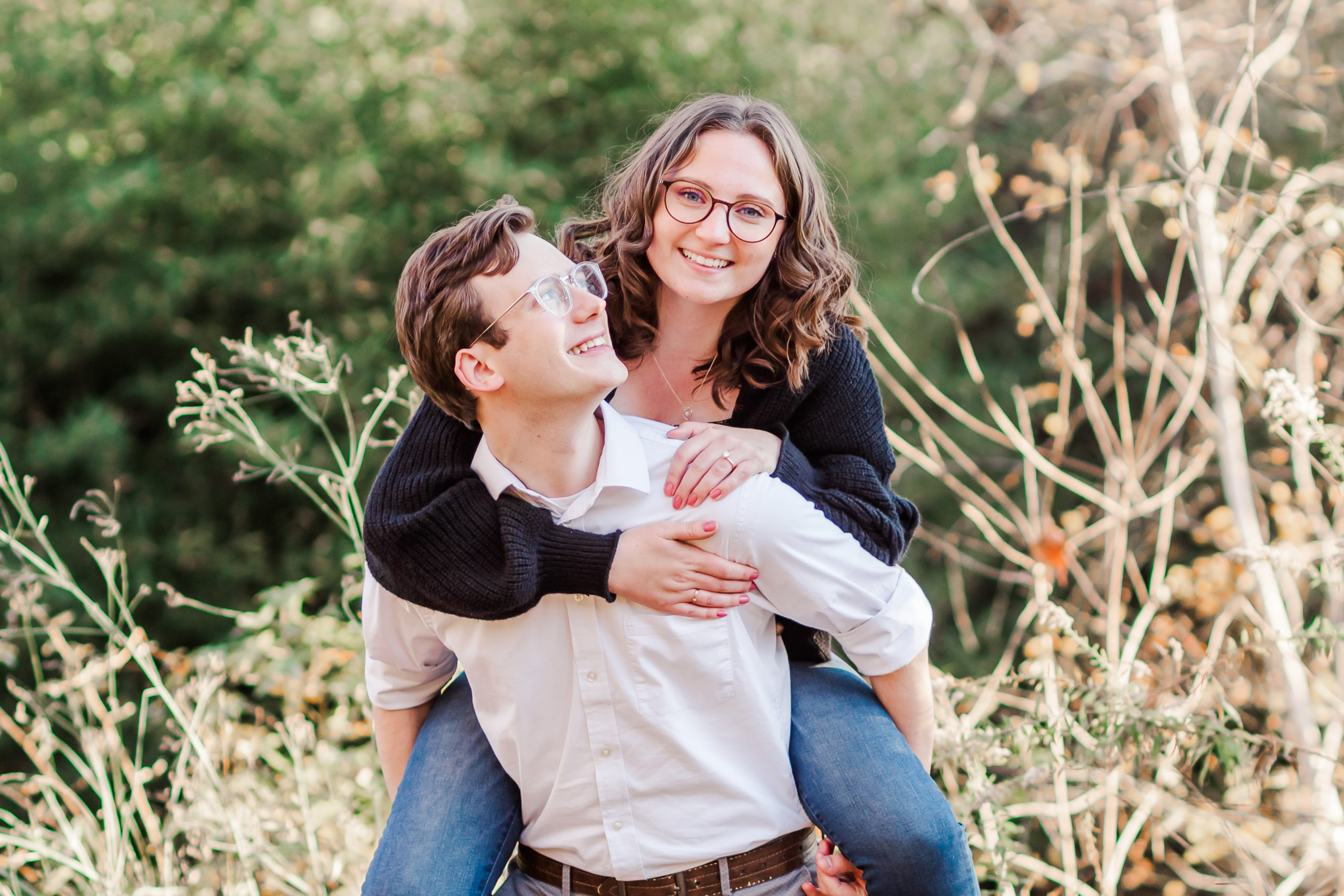 Kaitlyn getting a piggy back ride from her fiancé James at Bass Lake Park engagement session